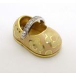 Aaron Basha - Boutique Jewellery : An 18k gold shoe formed charm decorated with floral enamel