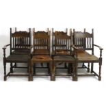 A set of eight early 20thC oak dining chairs (6+2) with slatted backrests and turned uprights,