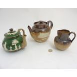 Three pieces of stoneware ceramics comprising a Royal Doulton salt glazed hunting teapot,