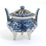 A Chinese blue and white three legged, two handled censer with pierced cover,