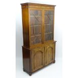 A mid 19thC mahogany astragal glazed bookcase,