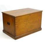 An early 19thC mahogany box of large proportions, with wrought iron carrying handles to either side.