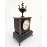 French Marble with urn finial : an 8 day 3 1/2" enamel dial mantel clock signed ' J Larrogue Vic