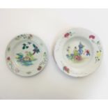 Two Chinese Famille Rose plates comprising a plate and bowl decorated with iridescent enamels,