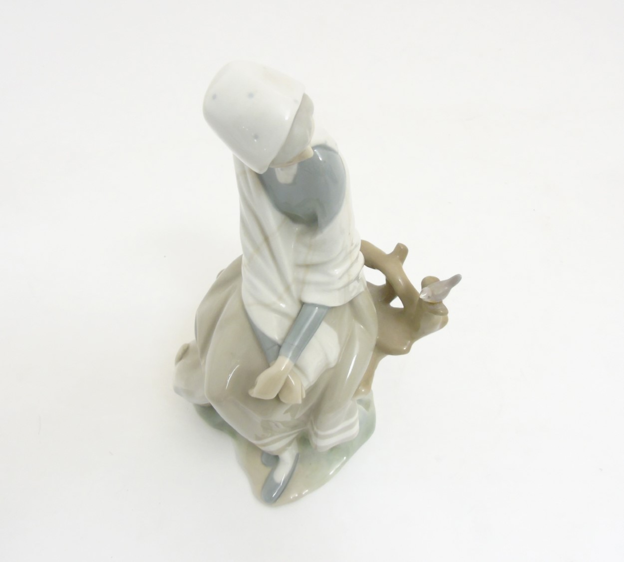 A Lladro 'New Shepherdess' figurine of a girl sat watching a bird, makers mark to base, - Image 2 of 8