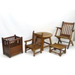 A collection of 'battleship' teakwood garden furniture to include a steamer chair, footstool,