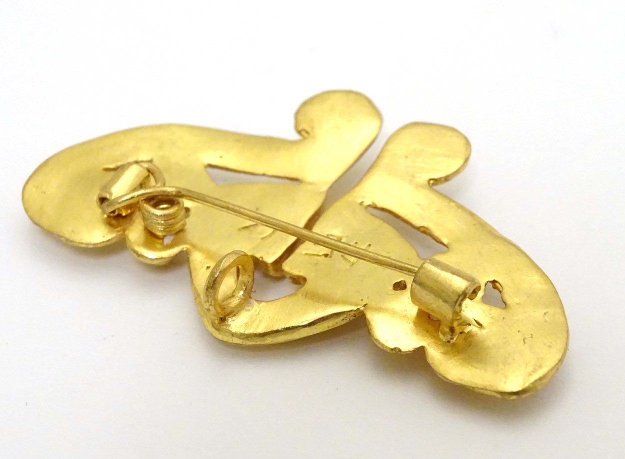 A gilt brooch of abstract form marked to reverse REU. - Image 4 of 6