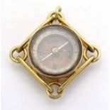 A yellow metal pendant fob one side set with compass, the other with bloodstone seal.