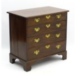 A George II mahogany bachelors chest comprising four long drawers to include a fitted top drawer