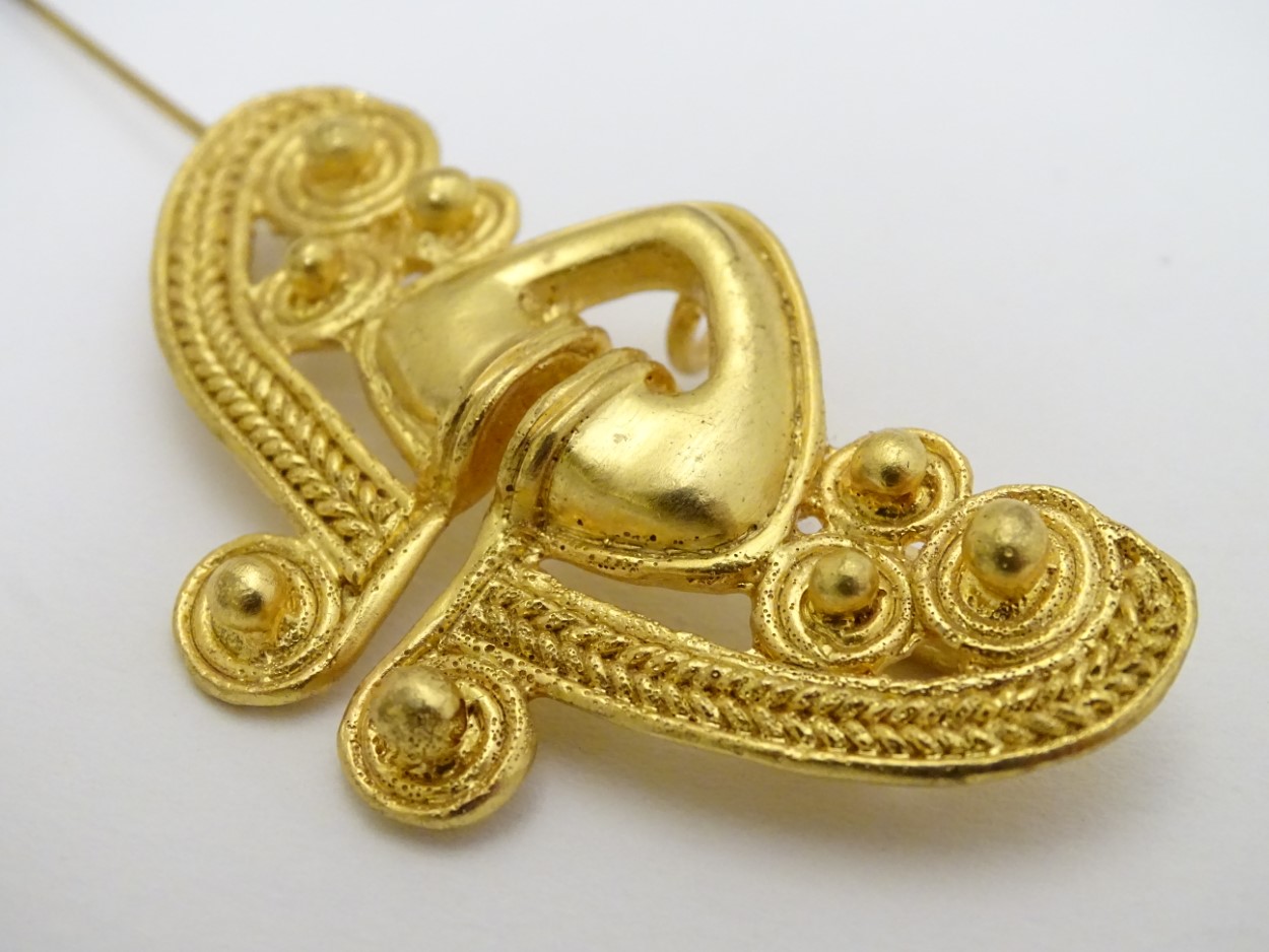A gilt brooch of abstract form marked to reverse REU. - Image 2 of 6