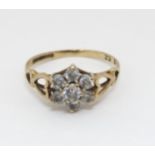 A 9ct gold ring set with 7 white stones CONDITION: Please Note - we do not make
