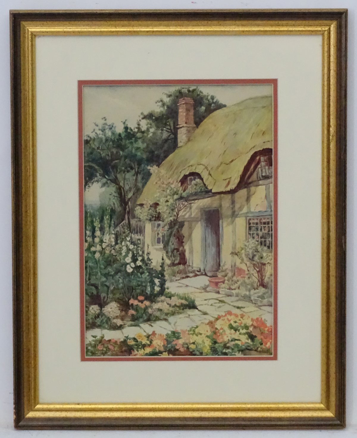 Mid- late XX English Cottage School, Watercolour, Hollyhocks before a thatched cottage. 11 3/4.