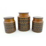 Three Retro Hornsea brown 'Heirloom' storage jars with wooden lids to include tea,