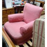 A pink upholstered armchair CONDITION: Please Note - we do not make reference to