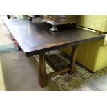 An oak dining table with canon barrel legs CONDITION: Please Note - we do not make