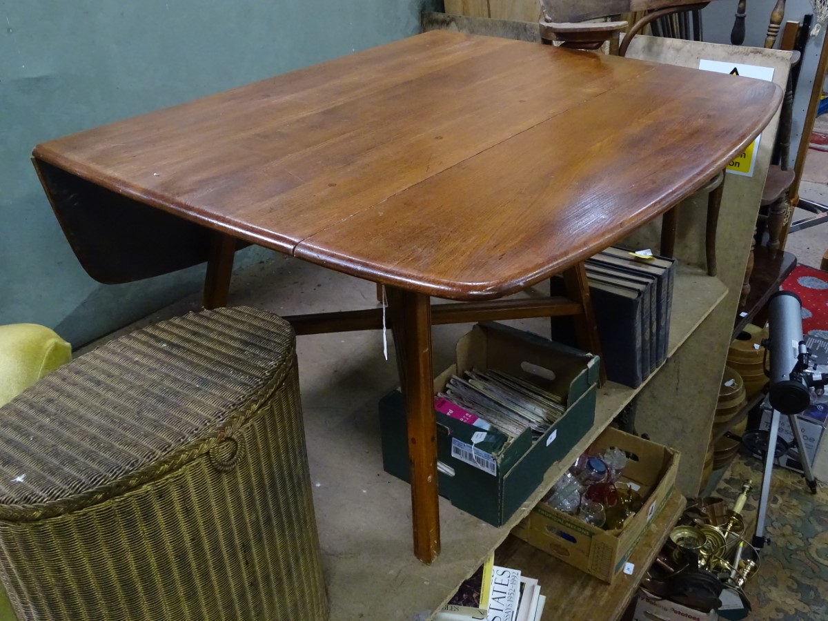 An early Ercol drop leaf dining table CONDITION: Please Note - we do not make