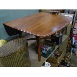 An early Ercol drop leaf dining table CONDITION: Please Note - we do not make