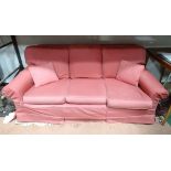 A three seater sofa with pink cross hatch upholstery CONDITION: Please Note - we do