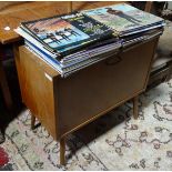 A large quantity of records together with a record cabinet, to include titles by The Beatles, Elvis,