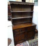 An oak dresser with linen fold decoration on the drawers CONDITION: Please Note -