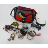 A handbag with bird decoration together with costume jewellery contents CONDITION: