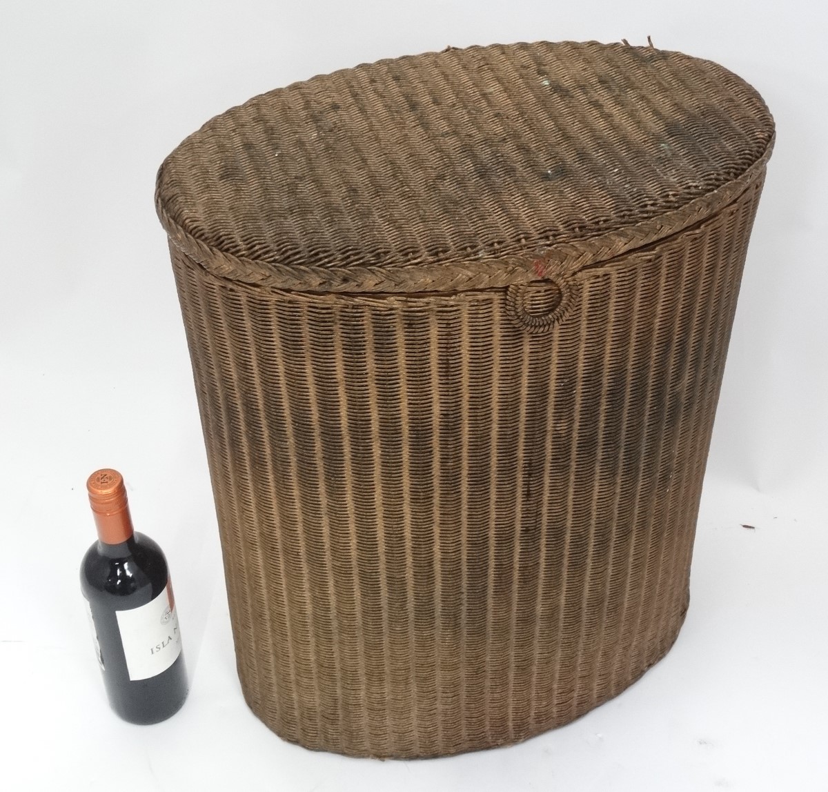 A Lloyd loom style washing basket CONDITION: Please Note - we do not make