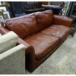 A brown leather sofa CONDITION: Please Note - we do not make reference to the