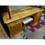 A pine dressing table and stool CONDITION: Please Note - we do not make reference