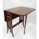 An Edwardian Sutherland small drop leaf table CONDITION: Please Note - we do not