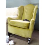 A wingback armchair CONDITION: Please Note - we do not make reference to the