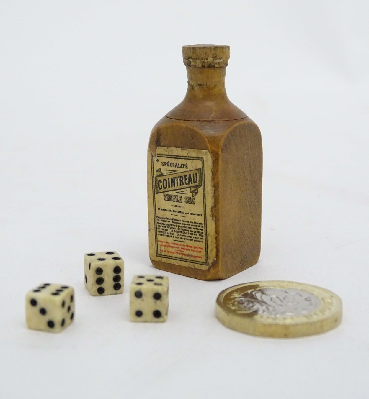 Cointreau Triple Sec - A novelty carved miniature boxwood bottle shaped container unscrewing to