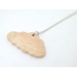 Minty Mountain: A local studio pottery pendant formed as a cloud on a white metal chain.