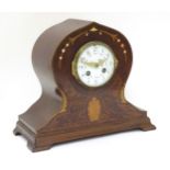 Edwardian mahogany Mantle clock : a shaped clock with J & R Paris Movement , striking on a bell ,
