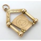 Masonic Interest : A 9ct gold fob with masonic imagery. Hallmarked Chester 1906.