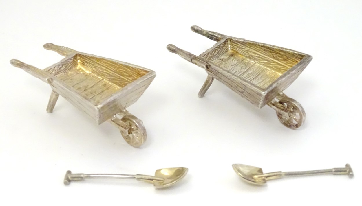 A pair of novelty silver table salts formed as garden wheelbarrows Hallmarked London 1998 maker CCP.