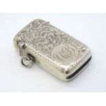 A silver vesta case with engraved decoration hallmarked Birmingham 1910.