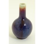 A Chinese sang-de-boeuf, high fired porcelain, small proportion bottle vase. Height: approx. 4".