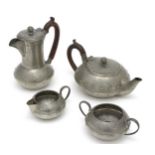 Arts and Crafts : a 'Homeland ' 4 piece pewter tea set , comprising of teapot , hot water pot ,