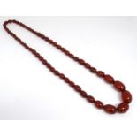 A Vintage necklace of graduated cherry amber coloured beads.
