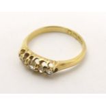 An 18ct gold ring set with 5 diamonds CONDITION: Please Note - we do not make