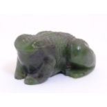 Lee-Roy Mullings of New Zealand: A carved dark green jade model of a toad/frog. Signed under.
