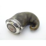 A 19thC Scottish rams horn snuff mull with white metal mounts and agate cabochon to lid.
