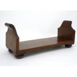 A rare Regency Mahogany desk book stand / book trough with of scrolled ends and squat bun feet ,