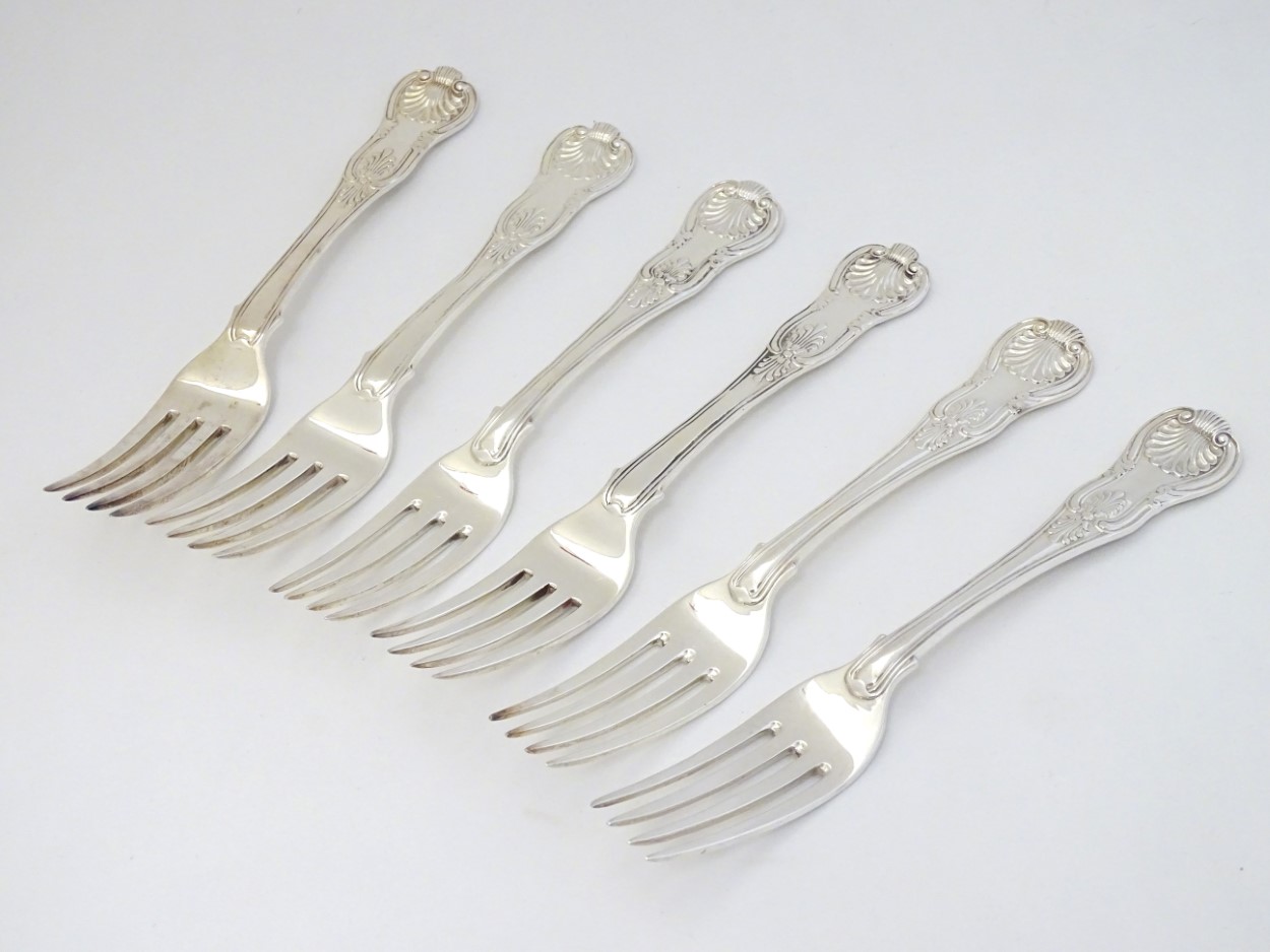 A matched set of 6 kings pattern table forks. hallmarked London 1817 and London 1824.