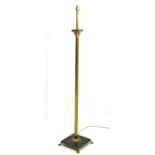 A standard lamp with brass Corinthian column decoration and green marble base on 4 lions paw feet.