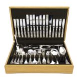 An 8-place canteen of silver plate flatware to include table forks, knives, spoons, fish eaters etc.