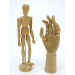 Artist's lay figures : a wooden mannequin hand and wooden mannequin figure on stand ,