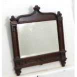 A late 19thC oak Gothic mirror with triple trefoil carved top,