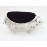 A white metal pin cushion formed as a pig 4" long CONDITION: Please Note - we do