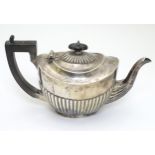 A silver teapot hallmarked Chester 1907 6" high overall ( total weight 376g) CONDITION: